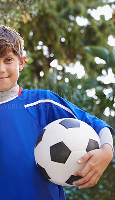 Buy stock photo Child, portrait and soccer ball for outdoor sport or practice training or competition, exercise or fitness. Male person, face and football game in kit or cardio playing in America, workout or athlete
