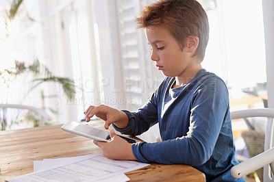 Buy stock photo Home, boy and paper with tablet for education on online learning for revision, study and child development. Homework, internet and research with information for assignment and school project.