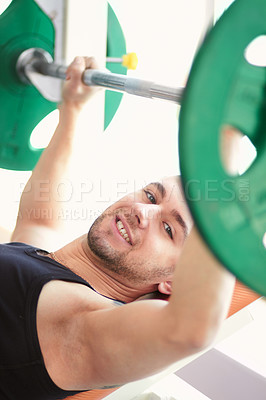 Buy stock photo Man, portrait and weightlifting in a gym with athlete wellness and smile from workout. Fitness, happy bodybuilder and male person with weights power from strong arm muscle and training at health club