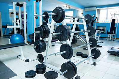 Buy stock photo Barbell rack, gym interior and fitness with equipment for wellness, healthy bodybuilding or training. Exercise, workout or health club with metal weights on shelf, strong body development and sports