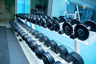 Buy stock photo Dumbbells, empty gym interior and fitness with equipment for wellness, healthy bodybuilding or training. Exercise, workout or health club with metal weights on shelf, strong body development or sport