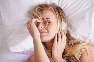 Buy stock photo Above, bed and wake up by woman in the morning after sleeping, rest and relax in her home. Top view, sleepy and dreaming girl in a bedroom on the weekend, calm and enjoying peaceful nap in her house