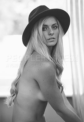 Buy stock photo Portrait, naked and body of woman in apartment for beauty, hair or sexy aesthetic of skin in Switzerland at home alone. Face, serious and nude topless female person in hat in black and white house