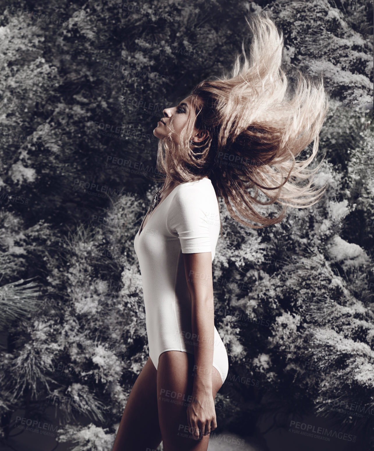 Buy stock photo Shot of a beautiful woman posing against a wintery background