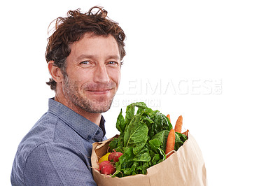 Buy stock photo Happy man, portrait and groceries in studio for product, discount and promotion. Person, delivery offer and smile in white background for nutrition, healthy food or fruits for diet with mockup