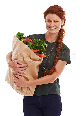 Buy stock photo Happy woman, portrait and groceries in studio for product, discount and vegetable shopping. Person, delivery offer and smile in white background for nutrition, healthy food and fruits for diet choice