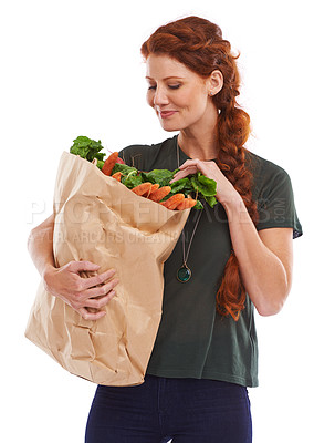 Buy stock photo Woman, grocery bag and vegetables nutrition in studio or healthy eating or food vitamins, fiber or white background. Female person carrots and wellness snack or lose weight diet, mockup space or meal