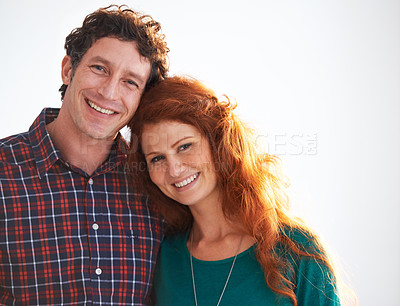 Buy stock photo Portrait of a happy and loving young couple standing indoors