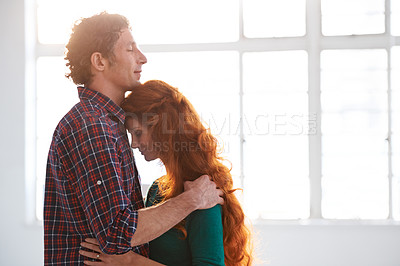 Buy stock photo Shot of a loving young couple sharing a tender moment