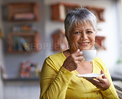 Buy stock photo Portrait of a mature woman enjoying a warm beverage at a coffee shop