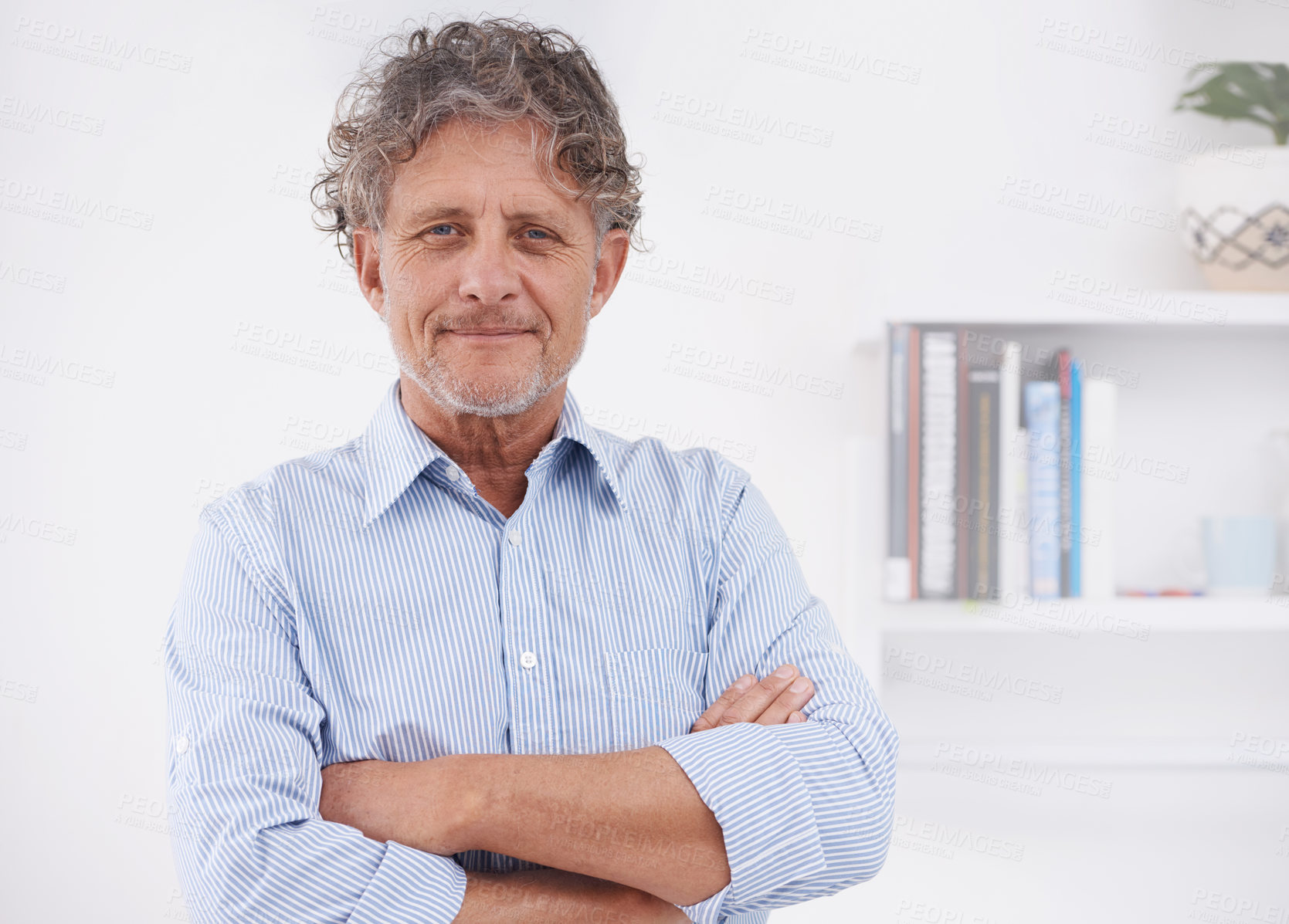 Buy stock photo A portrait of an optimistic businessman standing in his office