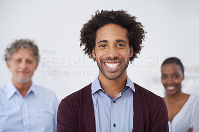 Buy stock photo Man, smile and portrait in office with colleagues for collaboration, meeting and career for organisation, agency or company. Diverse, team, coworkers and happy for teamwork and profession for job