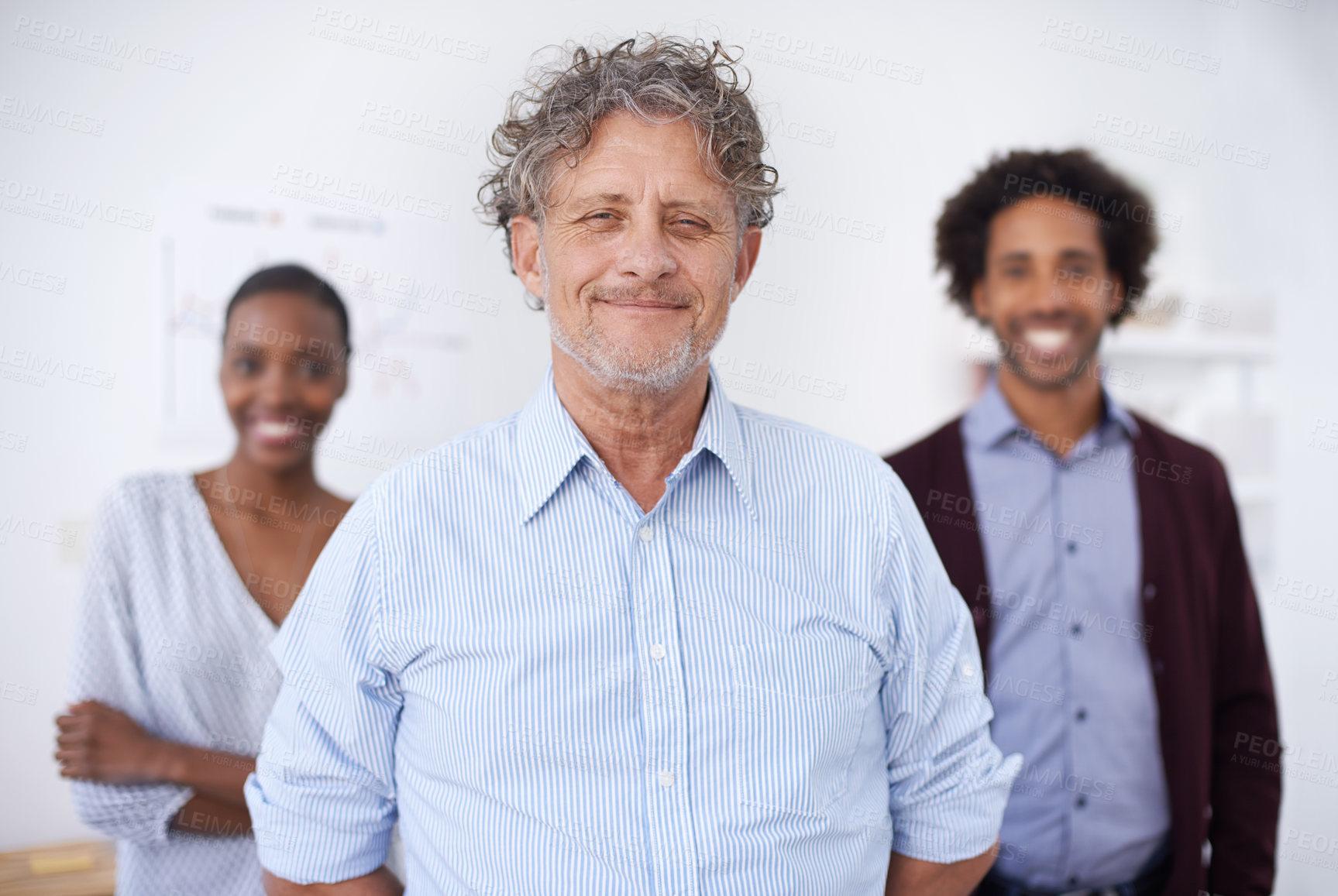 Buy stock photo A portrait of an happy team of coworkers standing in an office