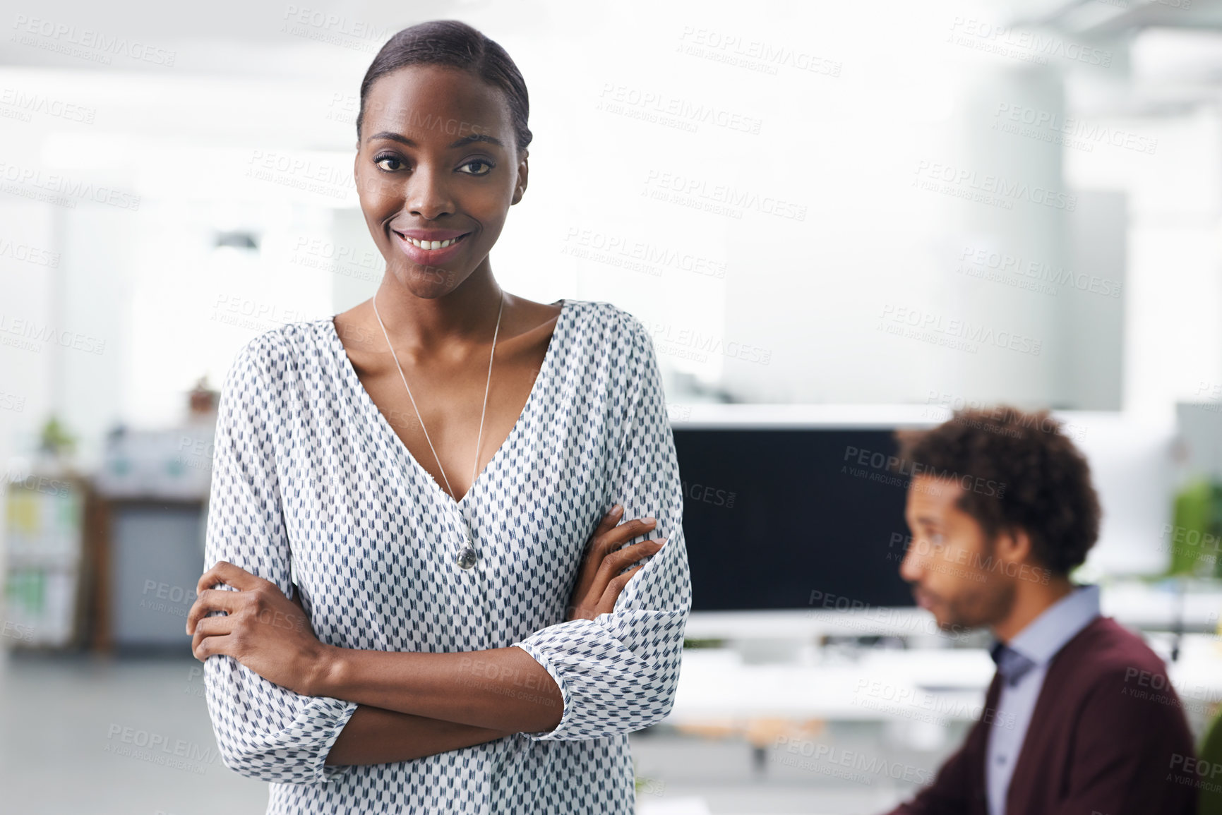 Buy stock photo Portrait of a young business woman standing with her arms crossed