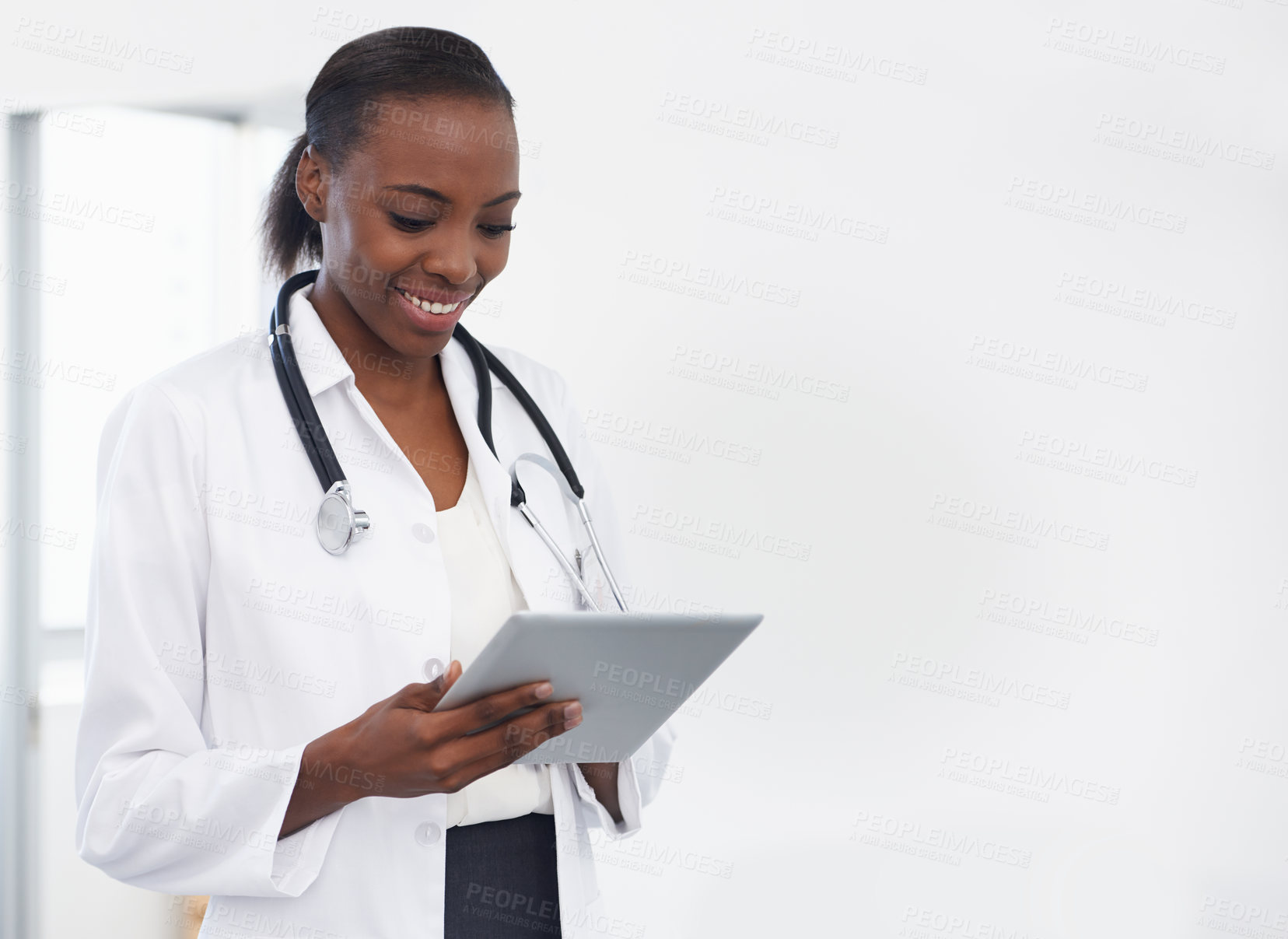 Buy stock photo Shot of a female doctor holding a digital tablet