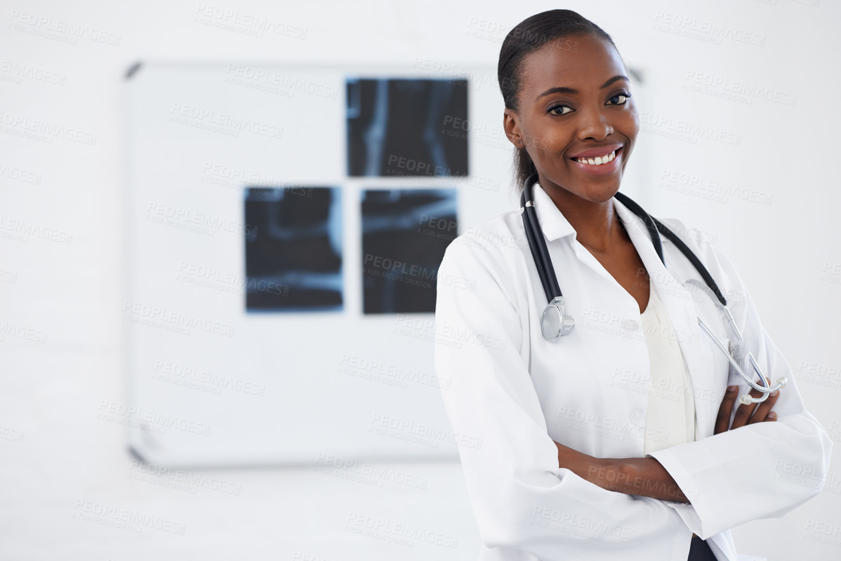 Buy stock photo Portrait, healthcare and female doctor with xray, smile and radiology in hospital. Medical, wellness or arms crossed for physician from Nigeria, bone or anatomy with stethoscope for assessment 