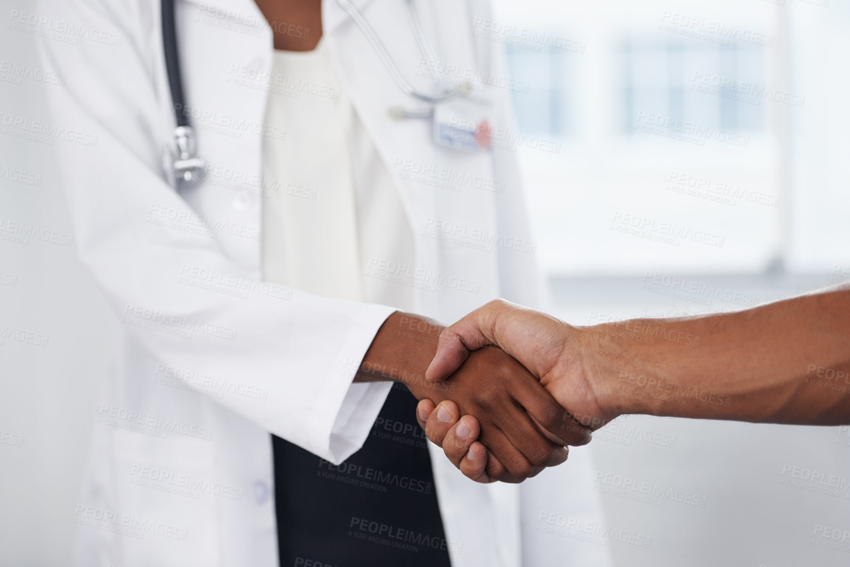 Buy stock photo Closeup, doctor and patient with a handshake, agreement and thank you for results, healthcare and wellness. Zoom, female employee or medical professional with a male client, greeting and hand gesture