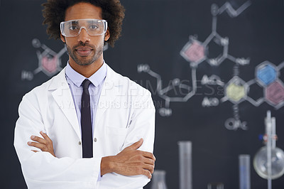 Buy stock photo A male scientist standing in front of a blackboard filled with drawings of chemical bonds