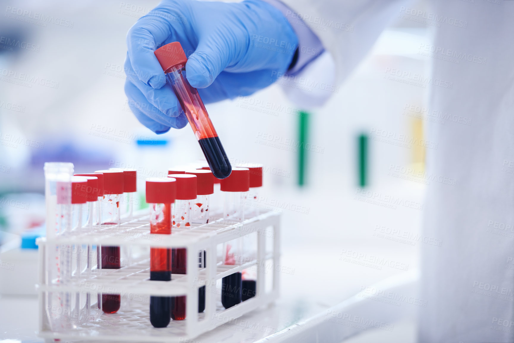 Buy stock photo Cropped shot of a scientist holding a test tube filled with blood