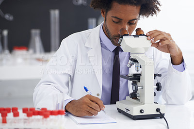 Buy stock photo Research, microscope and man scientist writing in notebook in office for medical, experiment or inspection. Science, healthcare and African health expert with virus study, testing or dna analysis