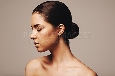Buy stock photo Woman, profile and gold glitter on eyes for beauty, cosmetology and glamour with cosmetics on beige background. Eyeshadow, makeup and fashion model in studio, art or creativity with shimmer and glow