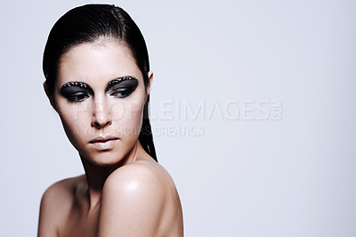Buy stock photo Woman, smokey and eyeshadow with makeup in studio for art and beauty, thinking and wondering with thoughts for cosmetics. Female person, isolated and white background, mockup space and glamour
