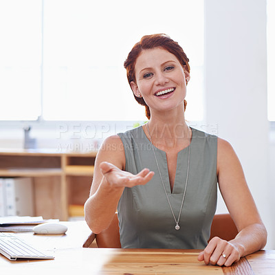 Buy stock photo Shot of an attractive young businesswoman working in her office