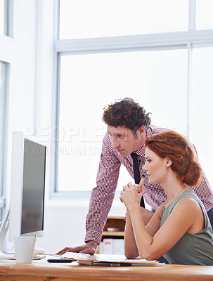 Buy stock photo Business people, teamwork and support on computer for training, advice or feedback on copywriting or project. Professional editor, leader or man and woman reading on desktop of report or editing