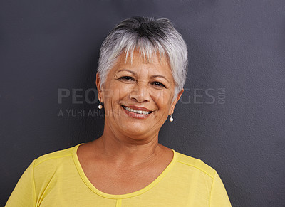 Buy stock photo Portrait of a mature woman standing in a studio