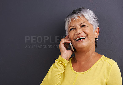 Buy stock photo Happy, phone call and senior woman in studio for communication, good news or gossip. Contact, mockup and elderly female person on mobile conversation with cellphone for talking by black background.
