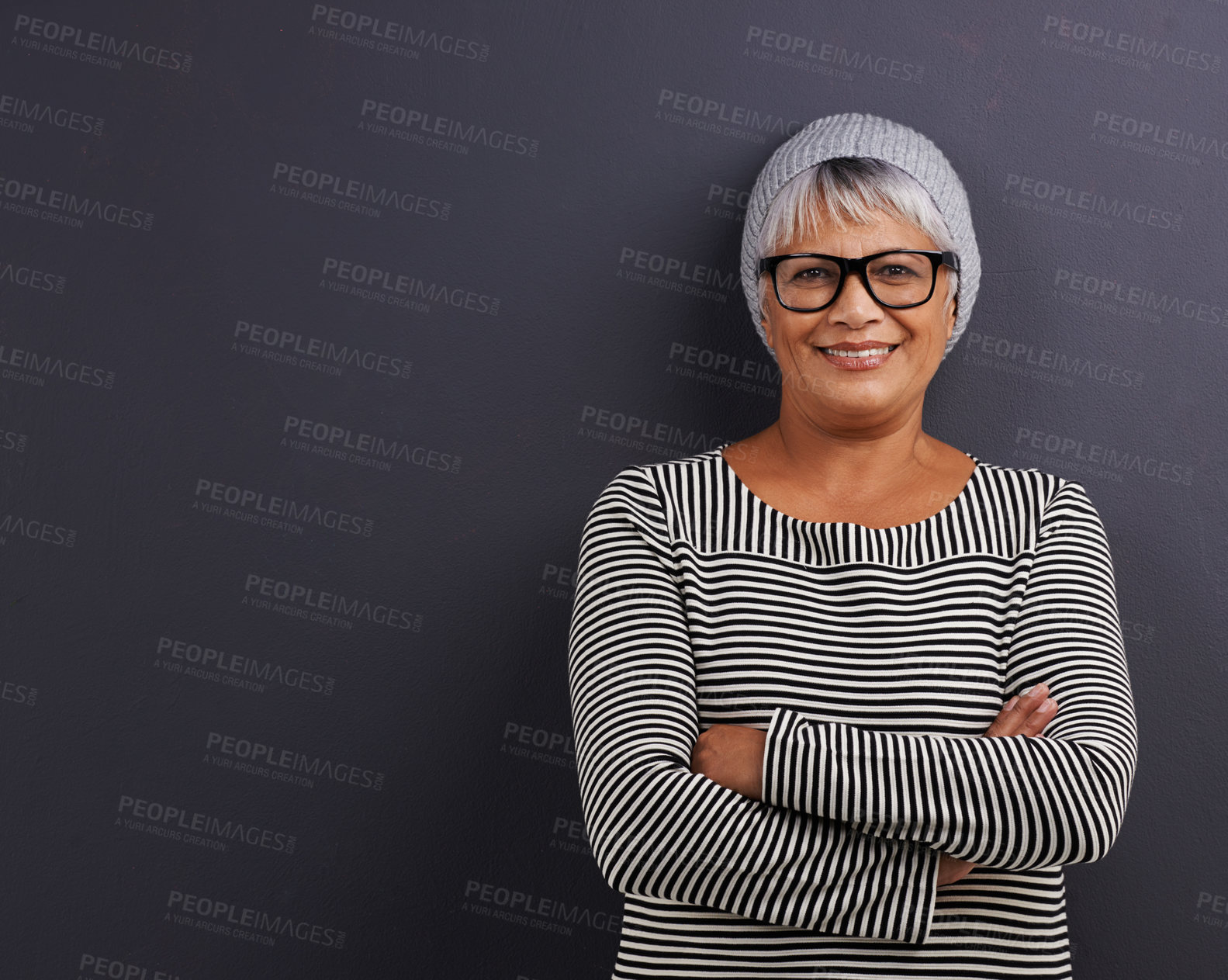 Buy stock photo Portrait of a mature woman standing in a studio