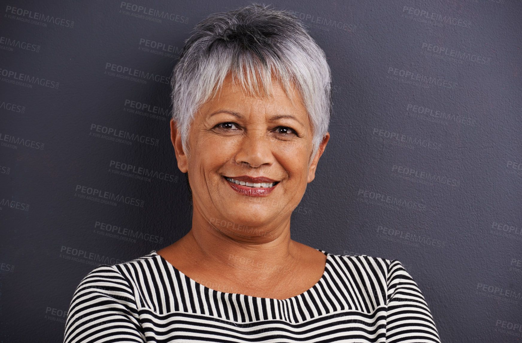 Buy stock photo Portrait of a mature woman standing in a studio