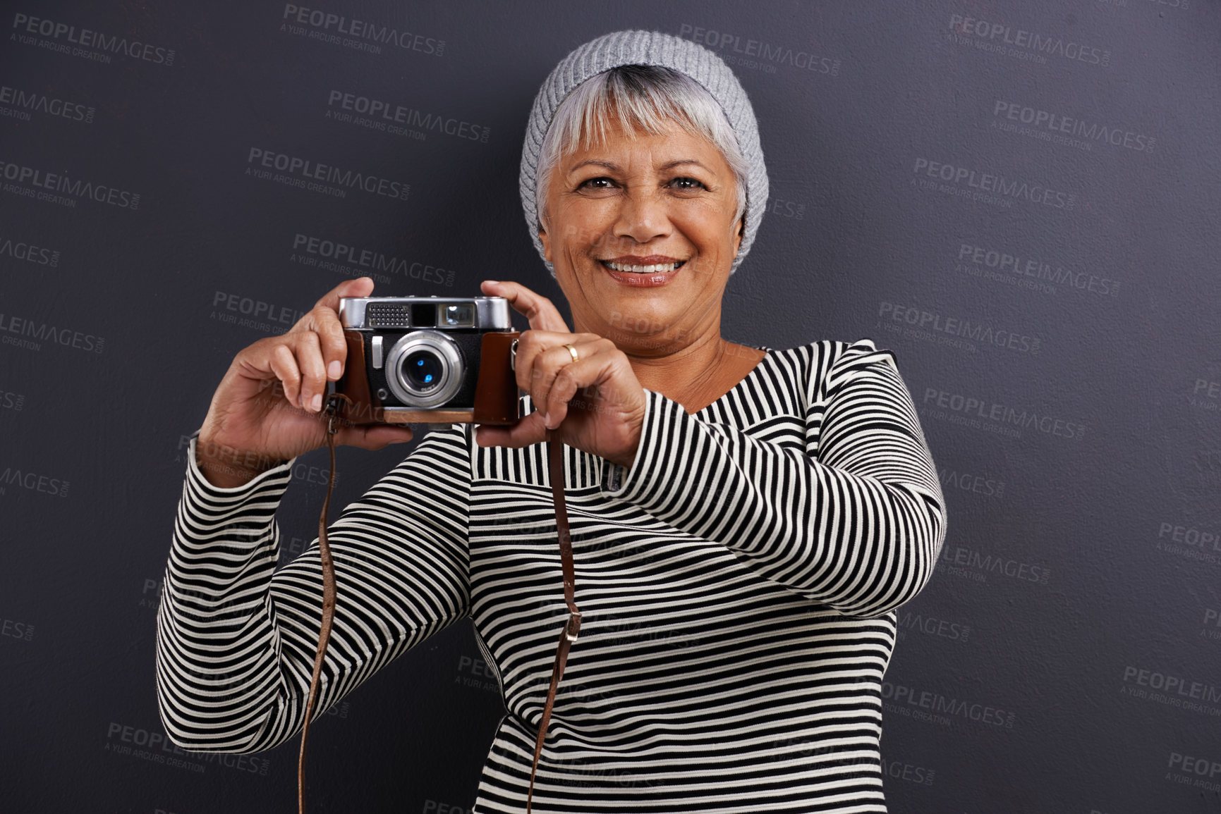 Buy stock photo Portrait, camera and photography with senior woman, creative and artistic on a dark studio background. Face, model and mature lady with photographer and hipster style with confidence and freelancer