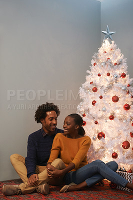 Buy stock photo Couple, Christmas and tree in apartment for holiday celebration for winter season, decoration or bonding. Man, woman and happy in home for present giving in America for event, connection or together