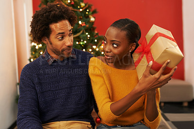 Buy stock photo Surprise, present and black couple on Christmas with box or opening package on festive holiday or vacation. Excited, woman and man offer a gift in home with love, kindness and curiosity in marriage