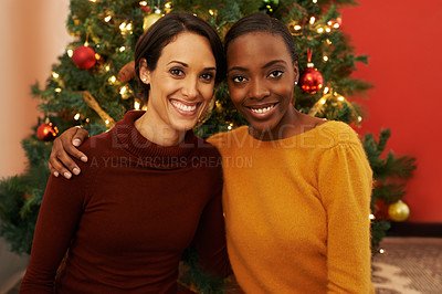 Buy stock photo Women, friends and portrait for Christmas holiday at tree for bonding celebration or festive season, vacation or connection. Female people, face and embrace in living room for joy, winter or break