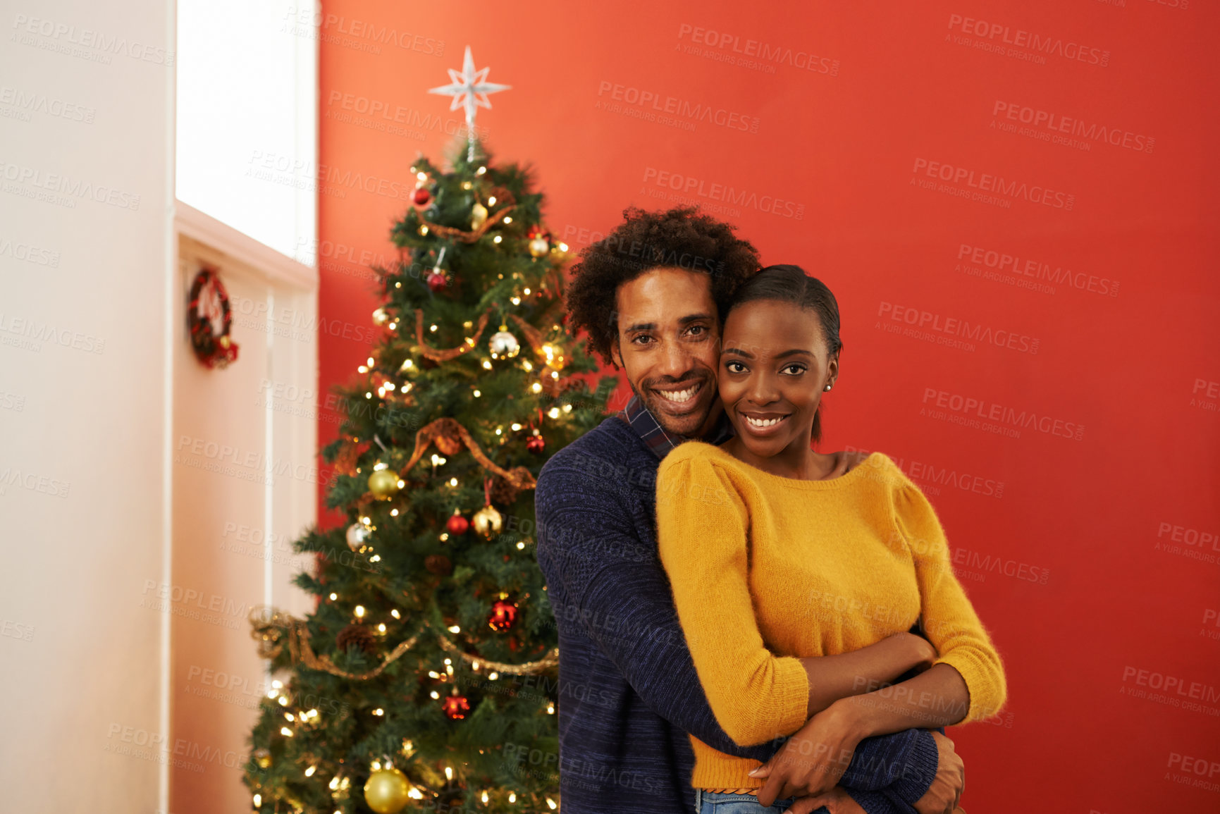 Buy stock photo Couple, portrait and Christmas celebration at tree or festive season decoration or bonding, vacation or marriage. Man, woman and smile in living room for relaxing holiday in America, giving or lights