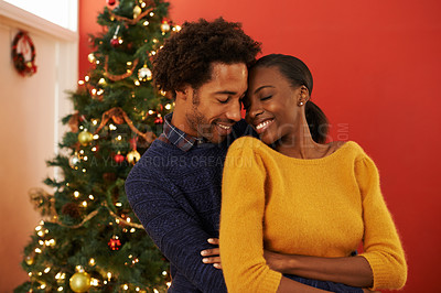 Buy stock photo Shot of a loving young couple on Christmas