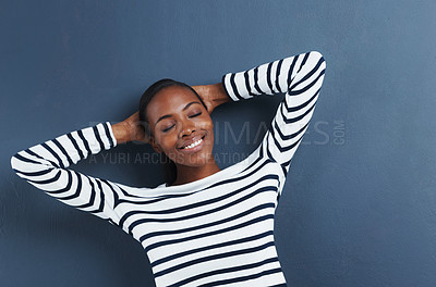 Buy stock photo Black woman, happy and eyes closed in studio to relax, peace and fashion top by blue background. African student, break and rest on hands for education, wellness and positive gen z with funky clothes