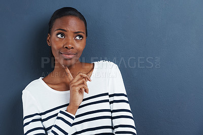 Buy stock photo Thinking, doubt and black woman with mockup in studio for planning, questions or asking on blue background. Why, curious or African female model with emoji guess, problem solving or brainstorming 