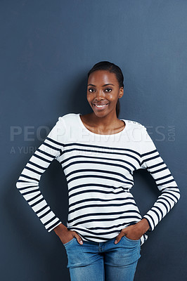 Buy stock photo Black woman, happy and portrait in studio with confidence and trendy fashion by blue background. African model, positive or face with hands in pocket, calm or pride in funky jeans for gen z aesthetic