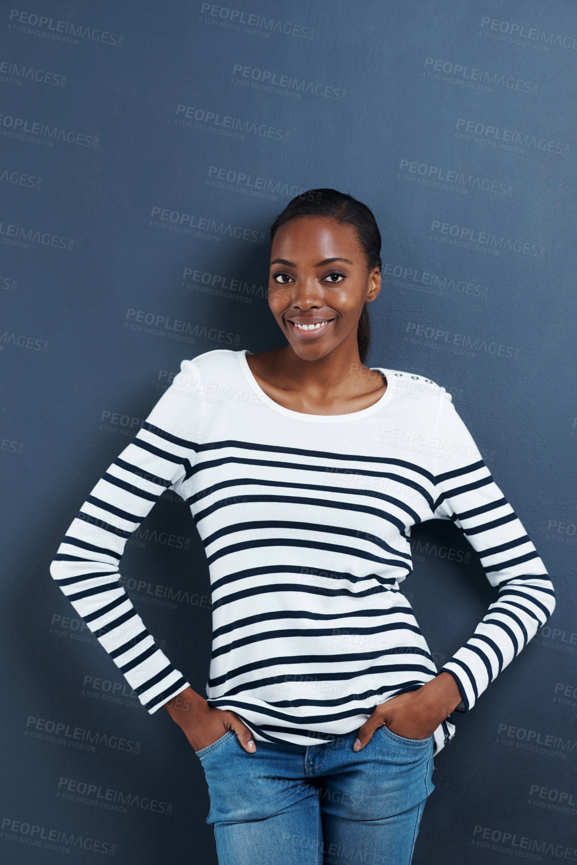 Buy stock photo Black woman, happy and portrait in studio with confidence and trendy fashion by blue background. African model, positive or face with hands in pocket, calm or pride in funky jeans for gen z aesthetic