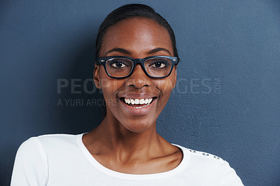 Buy stock photo Black woman, portrait and glasses with frame in studio, smile and trendy eyewear for optometry. Model, face and african person with fashion spectacles, vision and happy for eyecare by blue background
