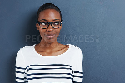 Buy stock photo Happy, thinking and black woman with glasses, ideas and thoughtful against a blue studio background. Female person, lady and girl with eyewear, clear vision and thoughts with decision and opportunity