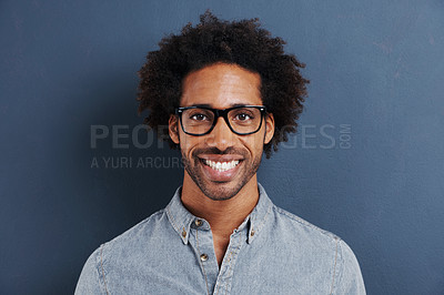 Buy stock photo Happy man, portrait and glasses with frame in studio and curly afro in trendy eyewear for optometry. Model, face and consultant in fashion spectacles, vision and smile for eyecare by blue background