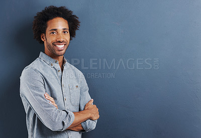 Buy stock photo Portrait, afro and black man with arms crossed, fashion and confidence on a grey studio background. Face, African person and guy with casual outfit and stylish clothes with smile and mockup space