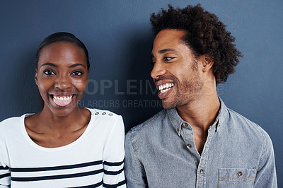 Buy stock photo Happy, portrait and black couple with love relax on studio background together with funny moment. Crazy, face and care for partner in silly profile picture of people with casual fashion or style