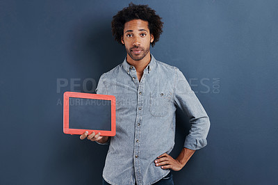 Buy stock photo Blackboard, portrait or man with mockup in studio for news, announcement or offer on blue background. Frame, presentation or face of guy model show space for promotion, info or sign up, guide or deal