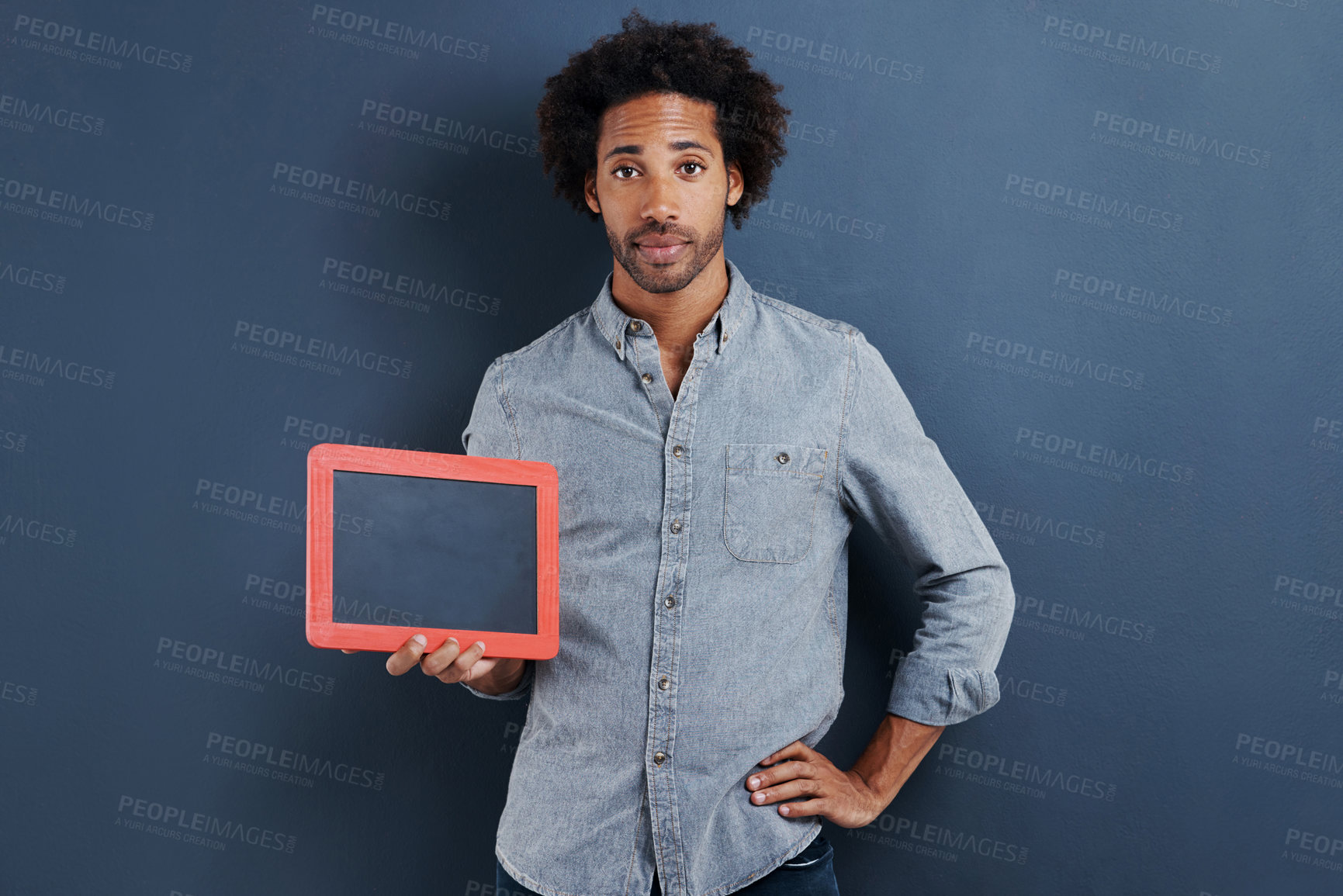 Buy stock photo Blackboard, portrait or man with mockup in studio for news, announcement or offer on blue background. Frame, presentation or face of guy model show space for promotion, info or sign up, guide or deal