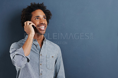 Buy stock photo Man, phone call and communication in studio for talking connection on blue background for chat, networking or smile. Male person, cellphone and mockup space for connectivity, contact us or discussion